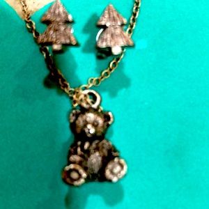 RUSS earrings and necklace inside a miniature trunk.